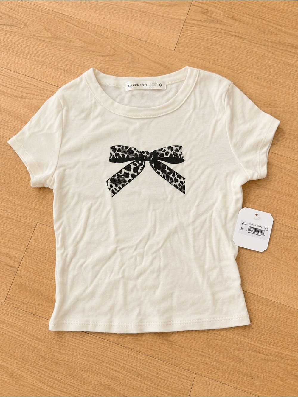 Altar'd State Cream Tee with Black Leopard Bow Graphic